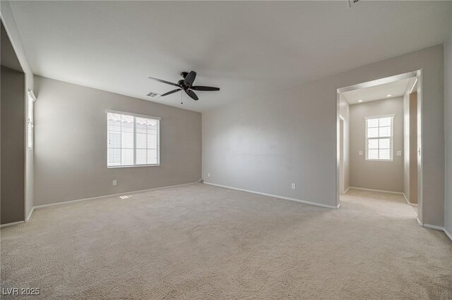 8348 Mokena Ave, Las Vegas, NV 89178 - unfurnished room featuring a ceiling fan, baseboards, and light colored carpet