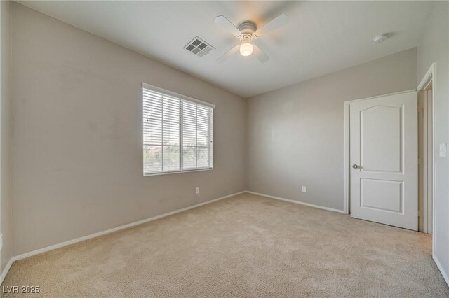 8348 Mokena Ave, Las Vegas, NV 89178 - empty room with light colored carpet, ceiling fan, and baseboards