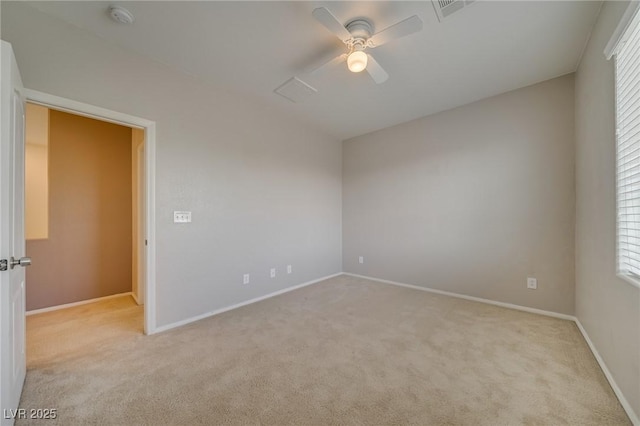 8348 Mokena Ave, Las Vegas, NV 89178 - empty room with light carpet, ceiling fan, a smoke detector, and healthy amount of natural light