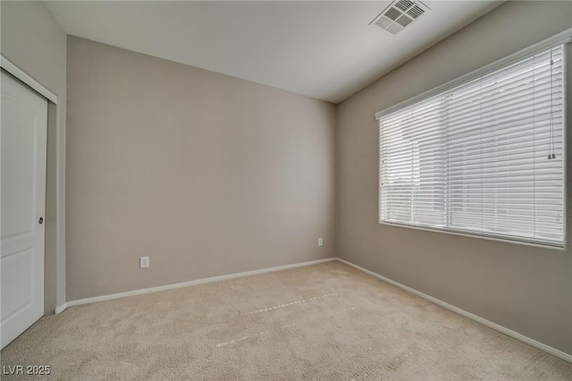 8348 Mokena Ave, Las Vegas, NV 89178 - unfurnished bedroom featuring light carpet, baseboards, and a closet