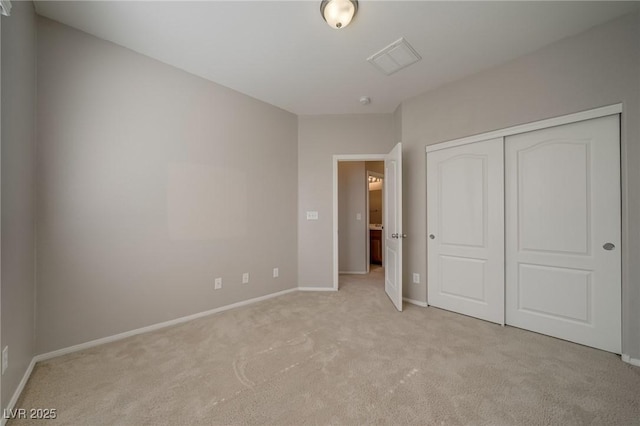 8348 Mokena Ave, Las Vegas, NV 89178 - unfurnished bedroom with light carpet, a closet, and baseboards