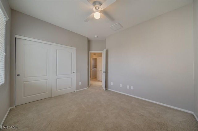 8348 Mokena Ave, Las Vegas, NV 89178 - unfurnished bedroom featuring light carpet, baseboards, a closet, and a ceiling fan