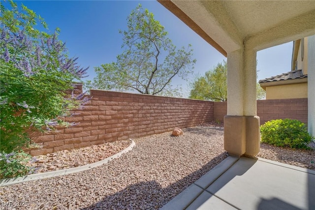 8348 Mokena Ave, Las Vegas, NV 89178 - fenced backyard with a patio area