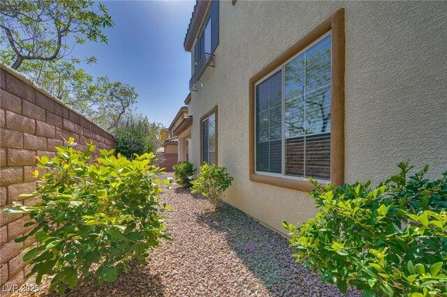 8348 Mokena Ave, Las Vegas, NV 89178 - view of side of home featuring stucco siding