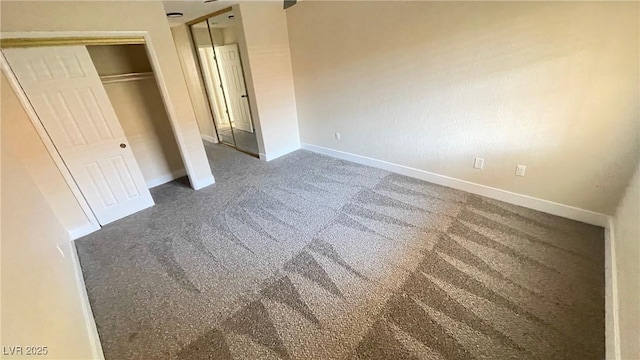 unfurnished bedroom with baseboards and carpet floors