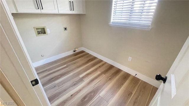 laundry area with hookup for a washing machine, wood finished floors, baseboards, and hookup for a gas dryer