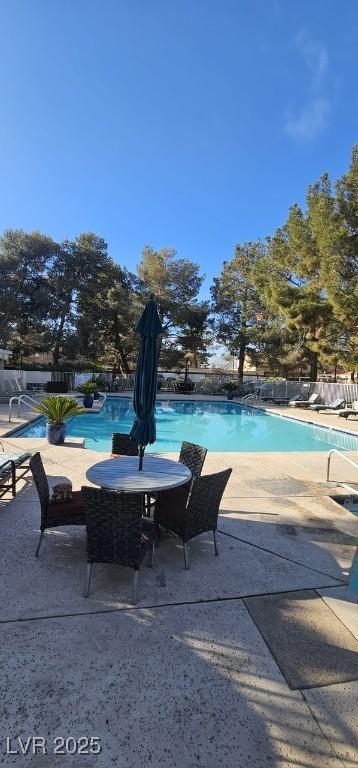 community pool featuring a patio area