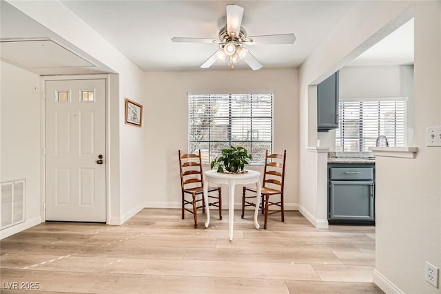 dining area with plenty of natural light, visible vents, and light wood-type flooring