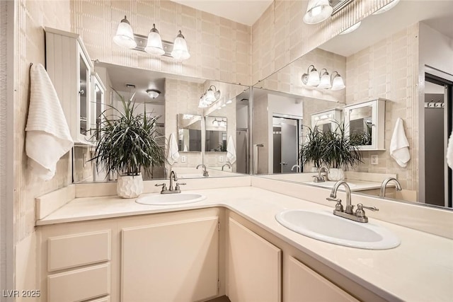 full bath featuring double vanity and a sink