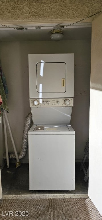 laundry area featuring laundry area and stacked washer and clothes dryer