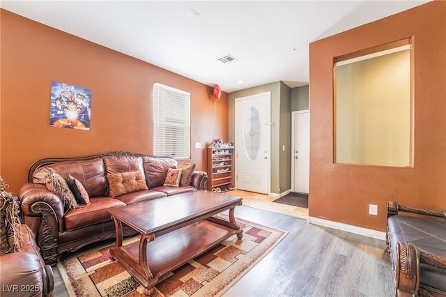 6177 W Cougar Ave, Las Vegas, NV 89139 - living area with light wood-type flooring, visible vents, and baseboards