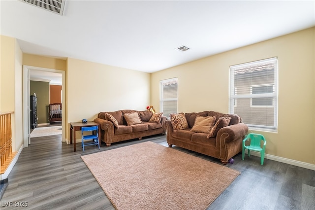 6177 W Cougar Ave, Las Vegas, NV 89139 - living area with wood finished floors, visible vents, and a wealth of natural light