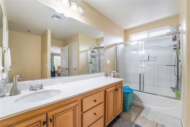 6177 W Cougar Ave, Las Vegas, NV 89139 - full bathroom featuring visible vents, enclosed tub / shower combo, vanity, and tile patterned flooring