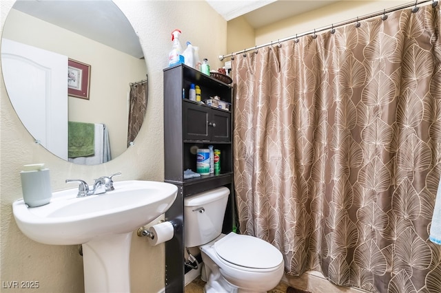 6177 W Cougar Ave, Las Vegas, NV 89139 - bathroom with toilet and a textured wall
