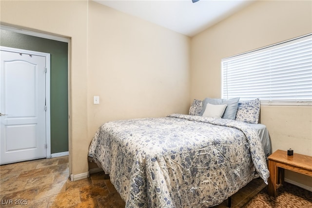 6177 W Cougar Ave, Las Vegas, NV 89139 - bedroom with stone tile floors and baseboards