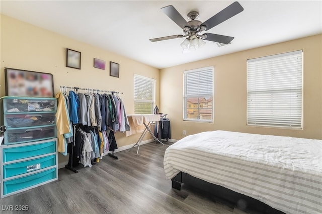 6177 W Cougar Ave, Las Vegas, NV 89139 - bedroom with a ceiling fan, baseboards, and wood finished floors