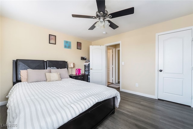 6177 W Cougar Ave, Las Vegas, NV 89139 - bedroom featuring baseboards, dark wood finished floors, and a ceiling fan