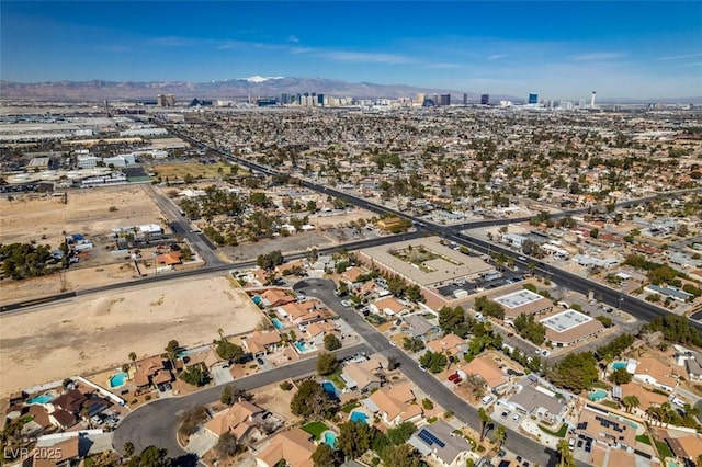 birds eye view of property featuring a mountain view