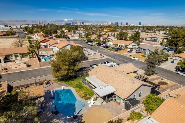 birds eye view of property with a mountain view