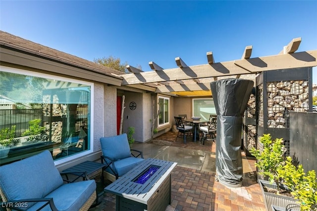 view of patio featuring outdoor dining area, fence, a pergola, and an outdoor fire pit