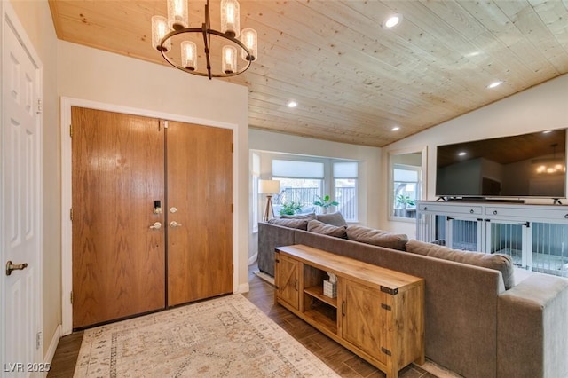 living area with recessed lighting, lofted ceiling, wood finished floors, and wooden ceiling