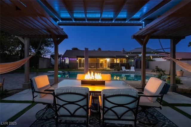 view of patio / terrace with a pergola, fence, and a fenced in pool