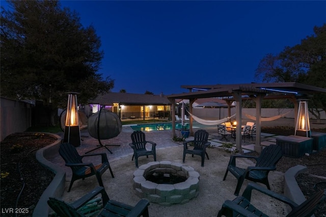 patio at twilight with a fenced in pool, a fire pit, a fenced backyard, and a pergola