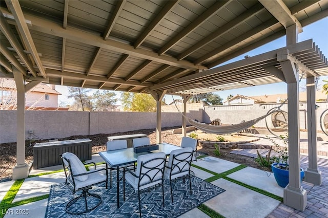 view of patio / terrace with outdoor dining space and a fenced backyard