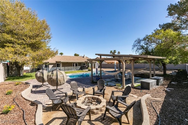 view of patio featuring a fenced in pool, an outdoor fire pit, and fence