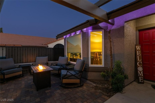 view of patio / terrace featuring an outdoor fire pit