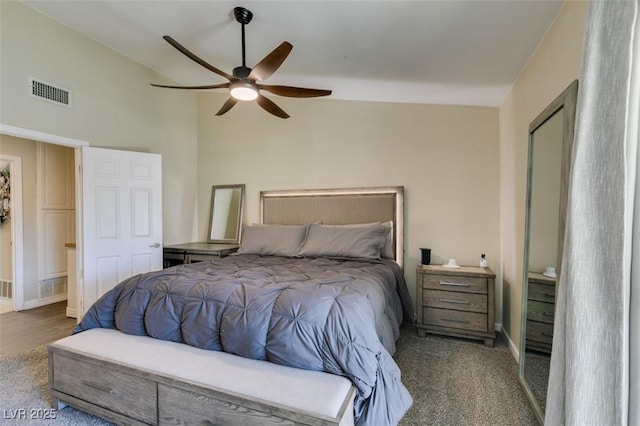 bedroom with visible vents, ceiling fan, baseboards, and vaulted ceiling