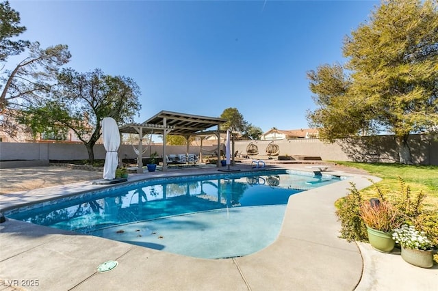 view of swimming pool with a patio, a diving board, a fenced backyard, and a fenced in pool