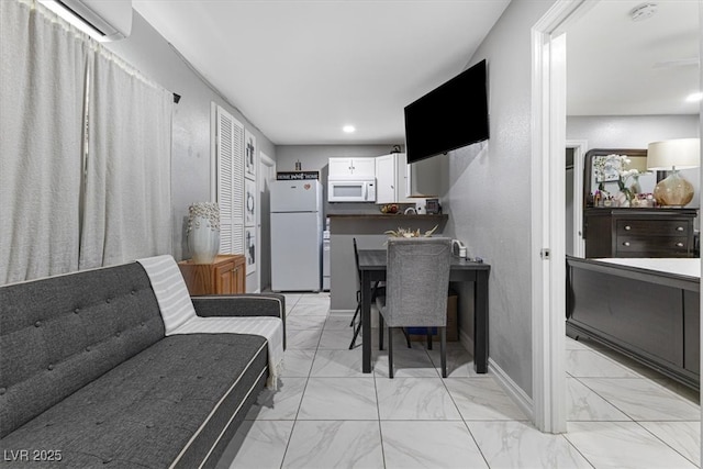 interior space with recessed lighting, baseboards, marble finish floor, and a wall mounted AC