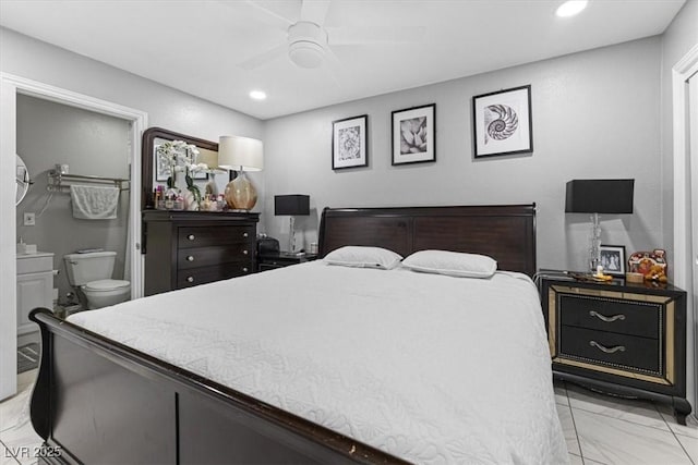 bedroom with ceiling fan, recessed lighting, marble finish floor, and connected bathroom