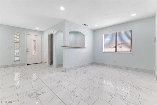 spare room featuring visible vents, recessed lighting, marble finish floor, and baseboards