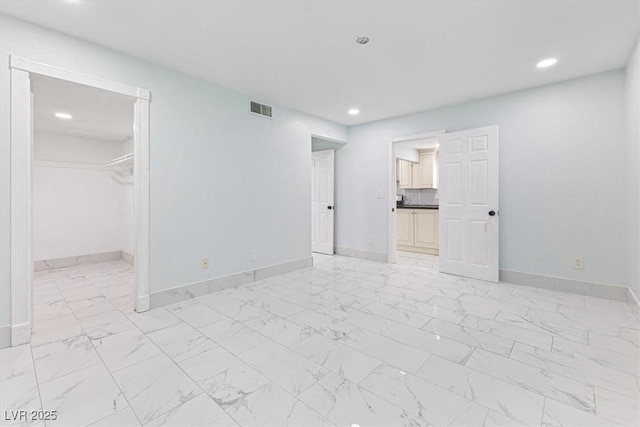 unfurnished bedroom with recessed lighting, visible vents, baseboards, and marble finish floor