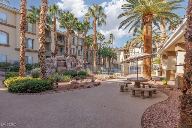 view of community featuring a patio area and fence