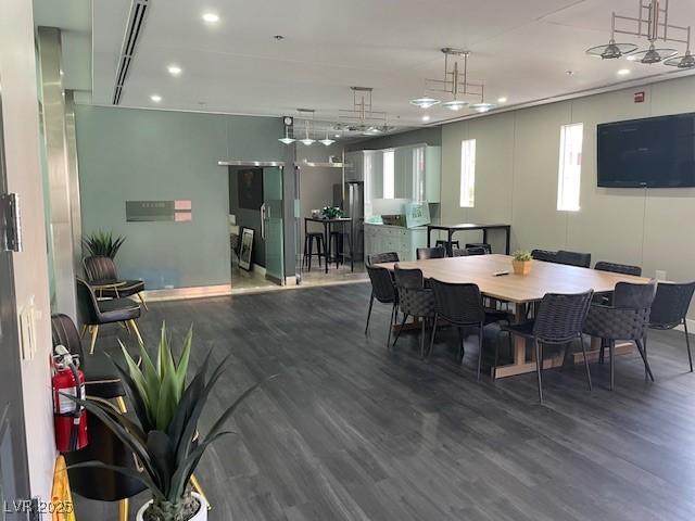 dining area with recessed lighting and wood finished floors