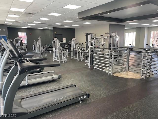 exercise room with a drop ceiling