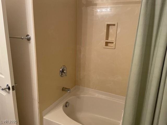 bathroom with shower / tub combo with curtain