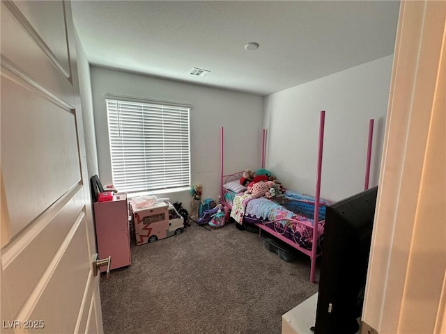 carpeted bedroom with visible vents