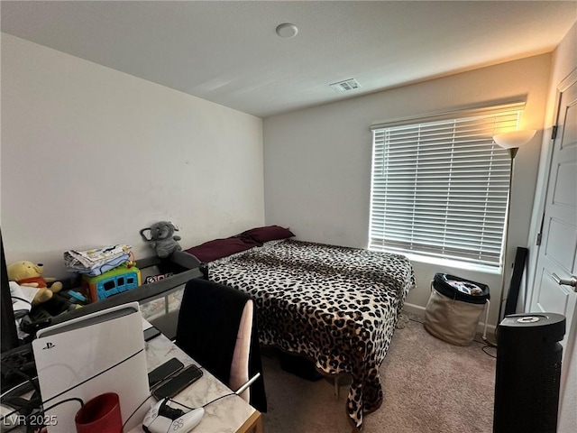 carpeted bedroom with visible vents