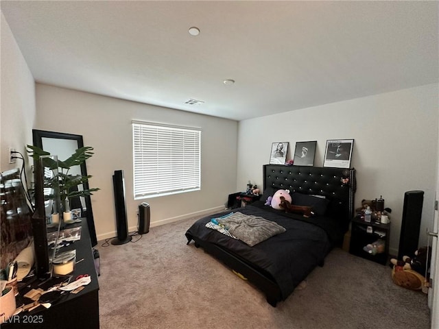 bedroom with visible vents, baseboards, and carpet