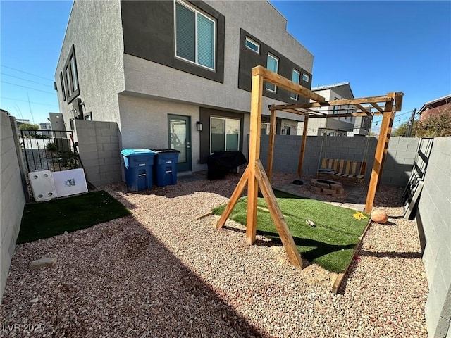 view of jungle gym with a fenced backyard and a pergola