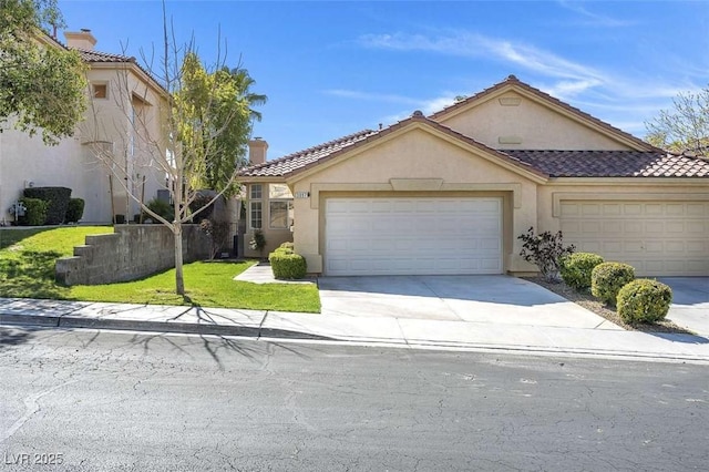 view of front facade with driveway, stucco siding, a front lawn, a garage, and a tile roof