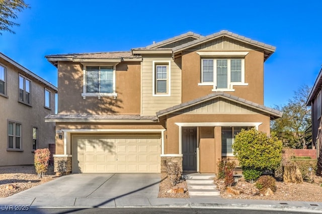 view of front of house with a tiled roof, stucco siding, a garage, stone siding, and driveway