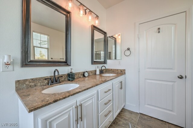 bathroom featuring double vanity and a sink