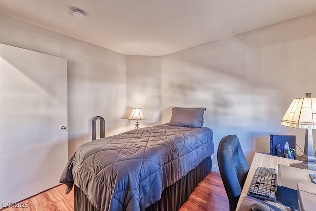 bedroom with wood finished floors