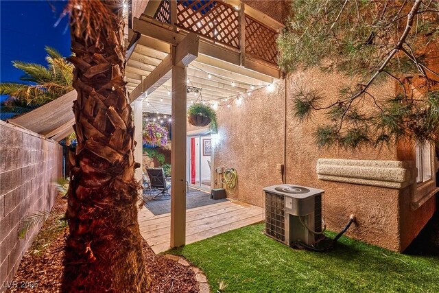 view of patio / terrace featuring central air condition unit, a deck, and fence