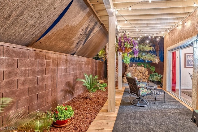 view of patio featuring fence